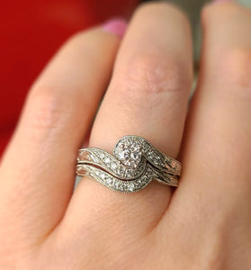 White gold vintage diamond wedding ring with curved halo and split prongs