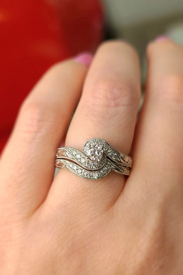 White gold vintage diamond wedding ring with curved halo and split prongs