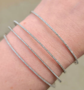 dainty white gold bracelet covered in sparkling diamonds