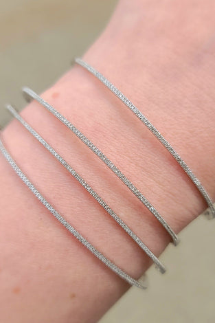 dainty white gold bracelet covered in sparkling diamonds