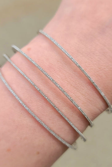 dainty white gold bracelet covered in sparkling diamonds