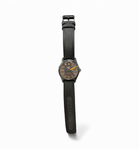 Seiko SRPH33 wristwatch with black fabric strap and dark round dial with orange accents