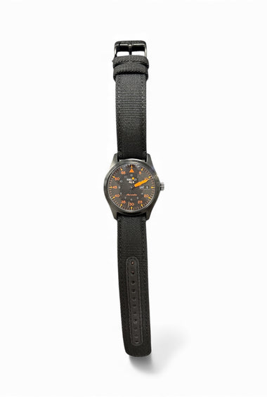 Seiko SRPH33 wristwatch with black fabric strap and dark round dial with orange accents