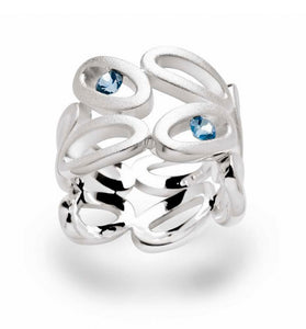 Symmetrical Sterling Silver ovals forming a ring set with blue topaz stones