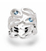 Symmetrical Sterling Silver ovals forming a ring set with blue topaz stones