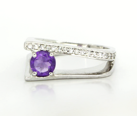 Sterling silver amethyst ring with oval purple gemstone and pavé crystal band