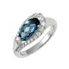 Oval gemstone halo ring in white gold with blue facets and round side stones