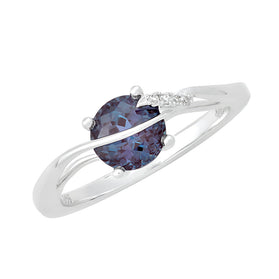14kt white gold ring with oval alexandrite center and lab diamonds on band