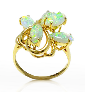 This 14k yellow gold ring features opal in a intricate design