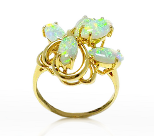 This 14k yellow gold ring features opal in a intricate design
