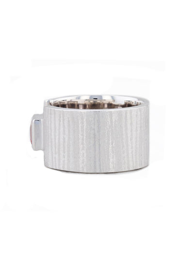 Textured sterling silver set with a pink topaz stone