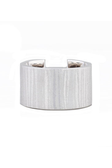 Textured sterling silver set with a pink topaz stone