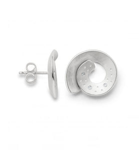 Diamonds are dusted throughout the scratch matte sterling silver forming the swirled studs