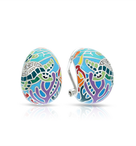 Turtles and flora hand painted on a sterling silver ring 