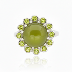 Sterling silver cabochon ring with round green center and peridot stone halo