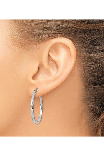 Twisted sterling silver hoop earrings with a wire and clutch closure