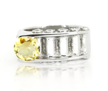 Sterling silver asymmetrical citrine ring, oval yellow center with clear side stones