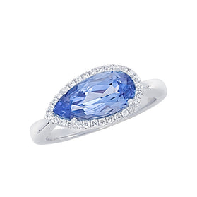 White gold ring: oval blue gemstone with diamond halo, slim band
