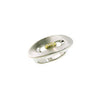 Silver ring with matte finish and gold center inset, shown from a low angle