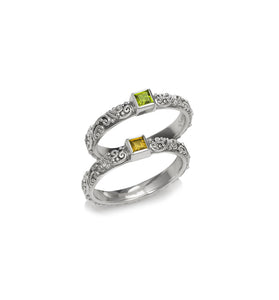 Sterling silver ring with ornate band and square green and yellow gemstones