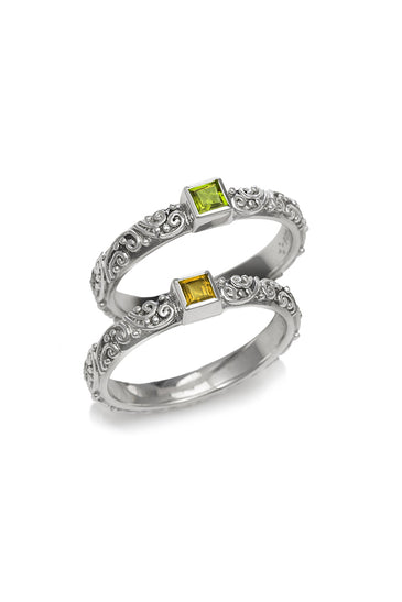 Sterling silver ring with ornate band and square green and yellow gemstones