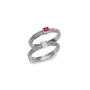 Sterling silver ring set with ornate filigree and two square gemstone insets, red and clear