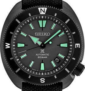 Men's black automatic watch with green indices, black bezel, and fabric strap.
