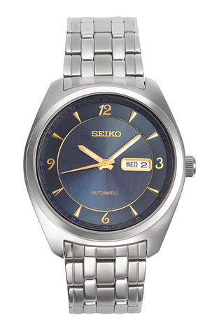 Men's Seiko automatic watch with blue dial, gold hands, and steel bracelet