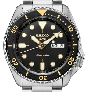 Men's Seiko watch with black dial, gold markers, and stainless steel bracelet
