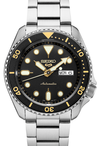 Men's Seiko watch with black dial, gold markers, and stainless steel bracelet