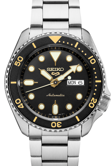Men's Seiko watch with black dial, gold markers, and stainless steel bracelet