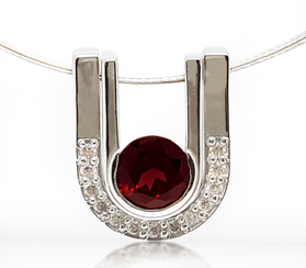 Sterling silver pendant with round red garnet and pave crescent frame