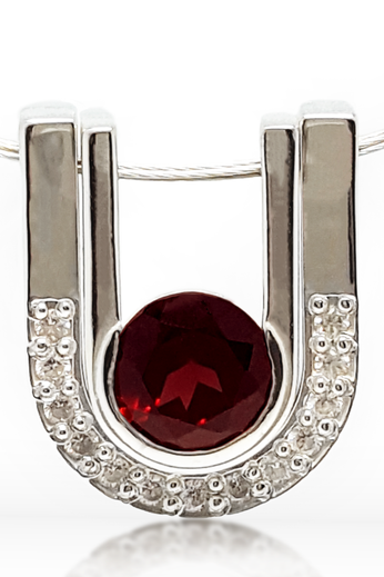 Sterling silver pendant with round red garnet and pave crescent frame