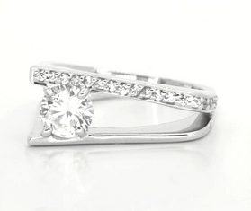 white topaz featured in a slip shank band of sterling silver