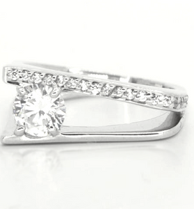 white topaz featured in a slip shank band of sterling silver