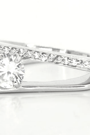 white topaz featured in a slip shank band of sterling silver