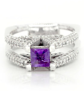 Regal princess cut amethyst adorned by white topaz on a sterling silver V ring