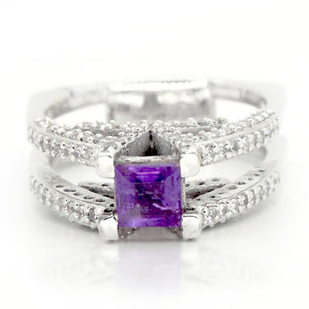 Regal princess cut amethyst adorned by white topaz on a sterling silver V ring
