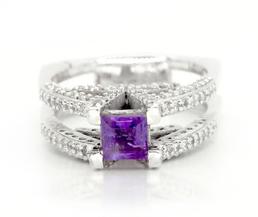 Regal princess cut amethyst adorned by white topaz on a sterling silver V ring