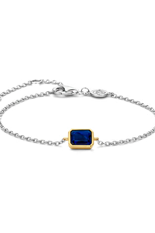 Sterling silver bracelet with blue square bezel charm and round clasp
