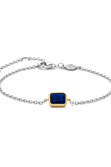 Sterling silver bracelet with blue square bezel charm and round clasp
