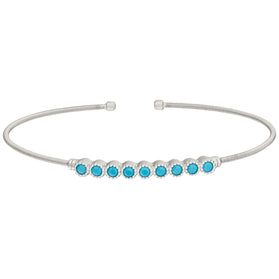 Sterling silver cuff bracelet with turquoise bead row and round end caps