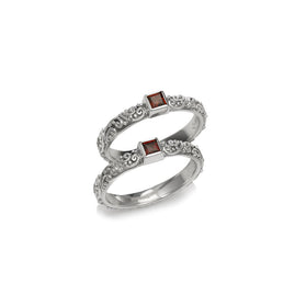 Sterling silver double-band ring with square garnet accents in geometric settings