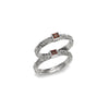 Sterling silver double-band ring with square garnet accents in geometric settings