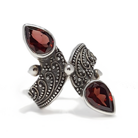 Sterling silver garnet ring with two marquise red stones and filigree design
