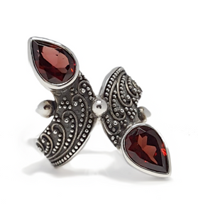 Sterling silver garnet ring with two marquise red stones and filigree design