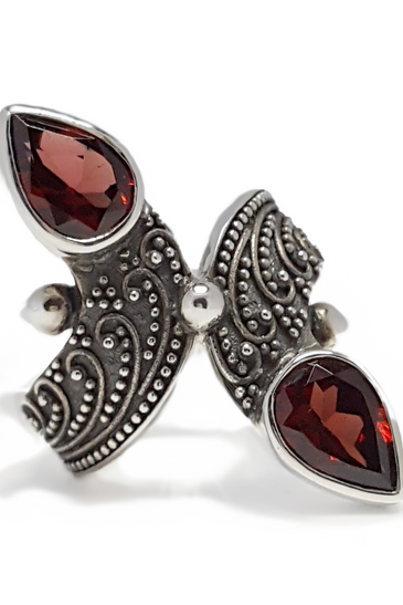 Sterling silver garnet ring with two marquise red stones and filigree design