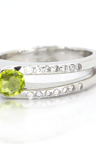 Sterling silver ring with a round peridot and white topaz