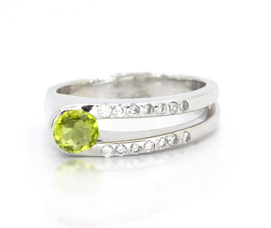 Sterling silver ring with a round peridot and white topaz