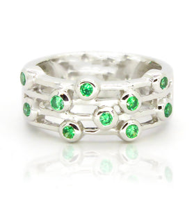 Whimsical sterling silver ring featuring green topaz with a bezel design